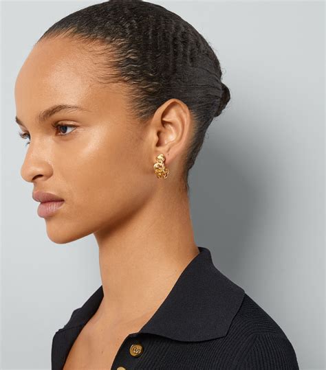 gold gucci stud earrings|Gucci interlocking g hoop earrings.